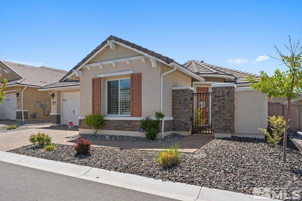 9543 Tencendur Lane Reno, NV 89521 - Photo 3 of 40 a front view of a house with garden