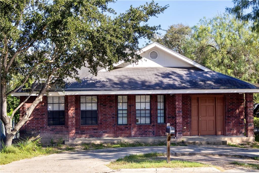 a front view of house with yard outdoor seating and barbeque oven