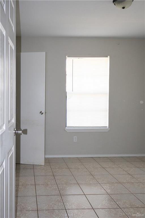 3301 South McColl Road McAllen, TX 78503 - Photo 18 of 28 a view of an empty room with a window
