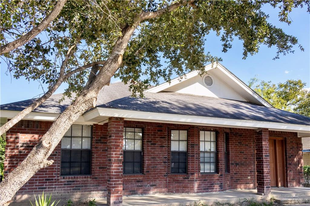 3301 South McColl Road McAllen, TX 78503 - Photo 2 of 28 a front view of a house with yard and glass windows