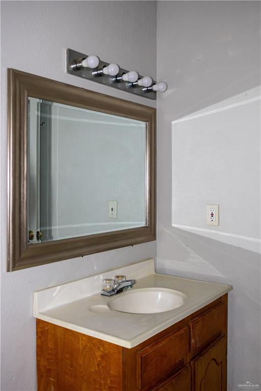 3301 South McColl Road McAllen, TX 78503 - Photo 22 of 28 a bathroom with a sink and a mirror