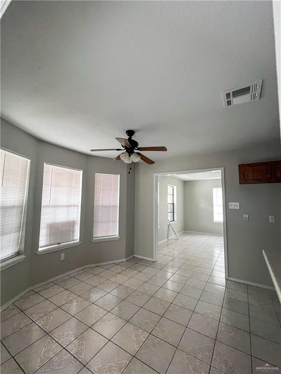 3301 South McColl Road McAllen, TX 78503 - Photo 4 of 28 a view of a livingroom with a ceiling fan and window
