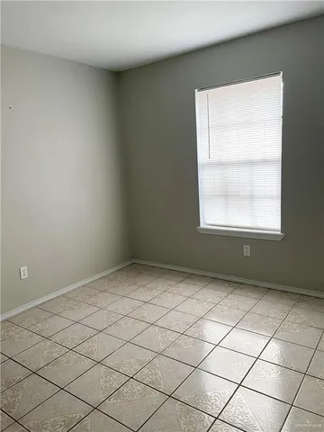 a view of an empty room and a window