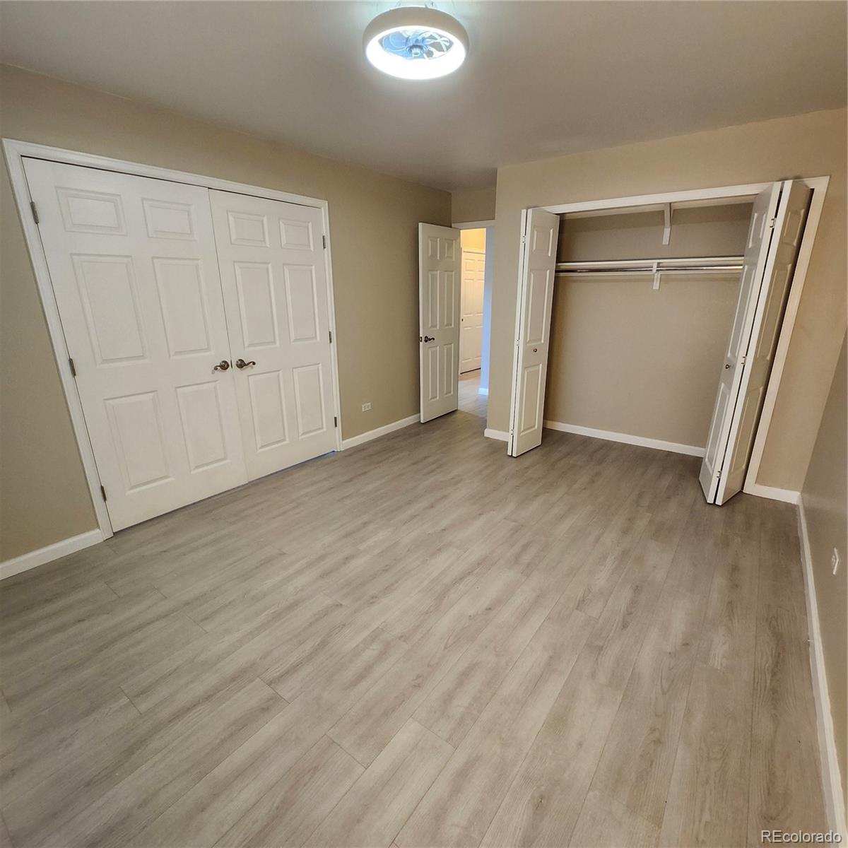 755 South Clinton Street, Unit 6B Denver, CO 80247 - Photo 20 of 48 an empty room with closet