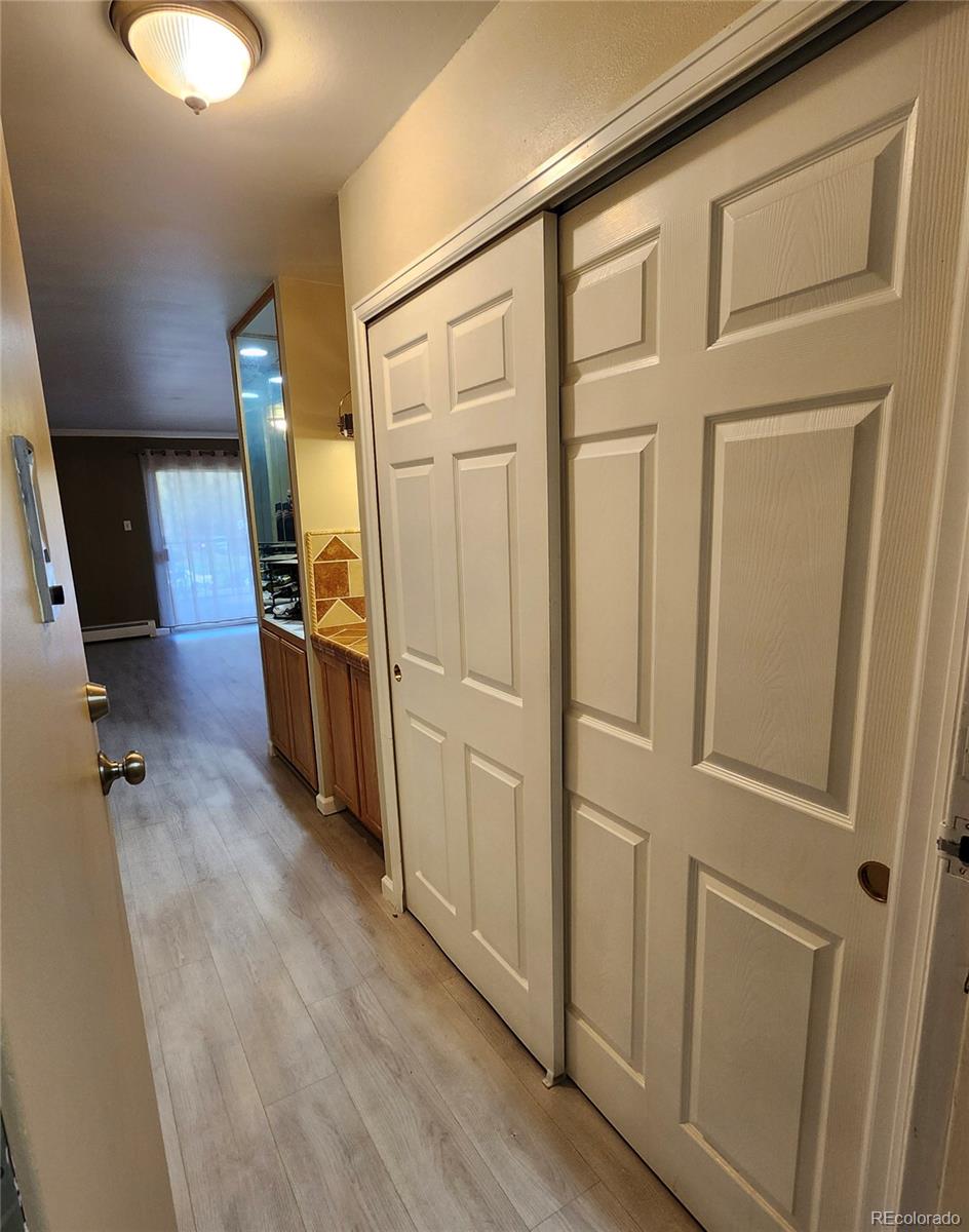 755 South Clinton Street, Unit 6B Denver, CO 80247 - Photo 2 of 48 a view of a entryway with wooden floor