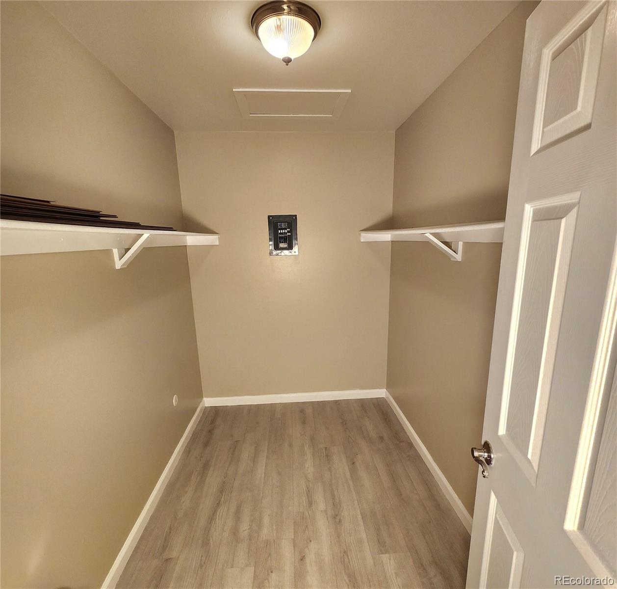 755 South Clinton Street, Unit 6B Denver, CO 80247 - Photo 22 of 48 a view of a room with wooden floor and small space