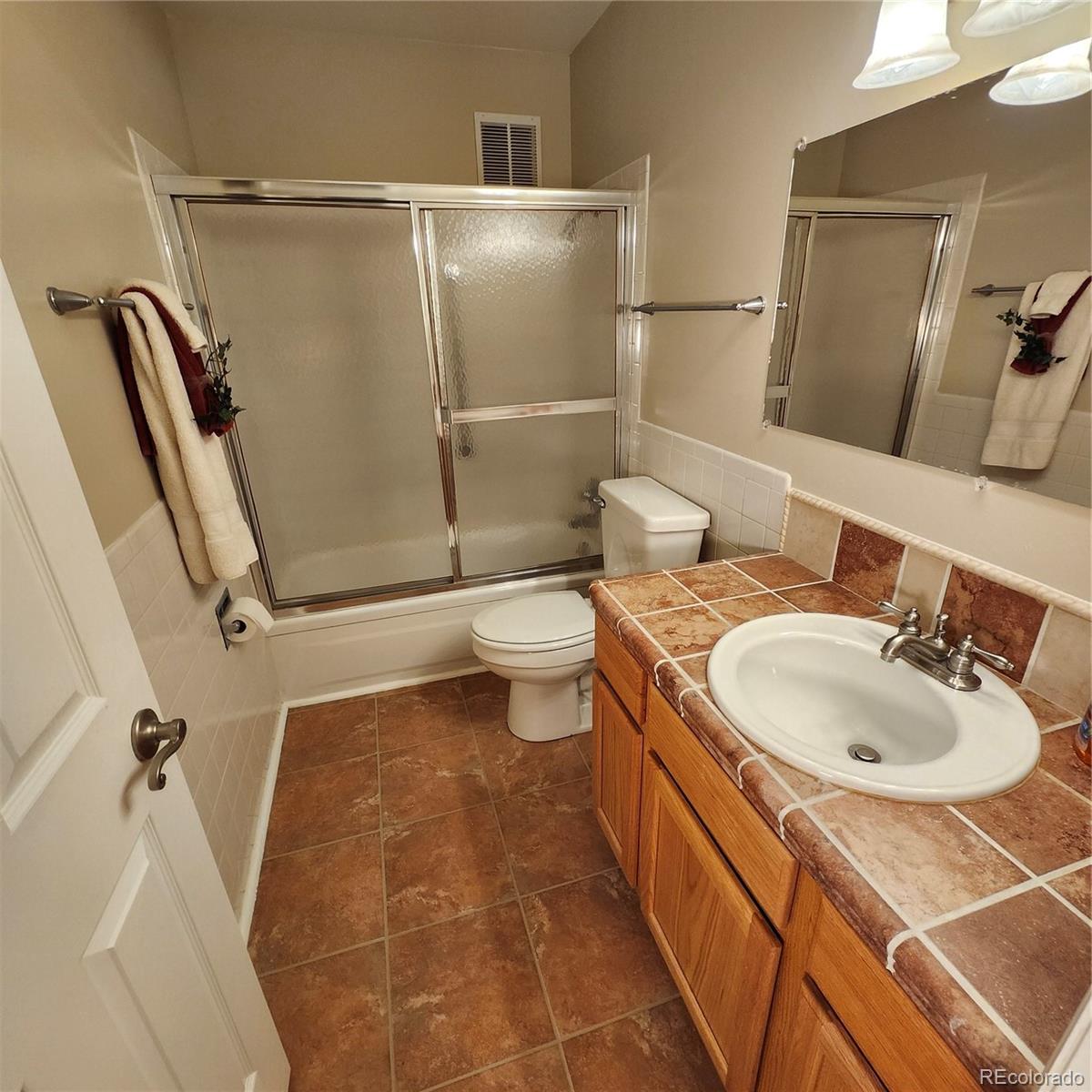 755 South Clinton Street, Unit 6B Denver, CO 80247 - Photo 23 of 48 a bathroom with a sink toilet and shower