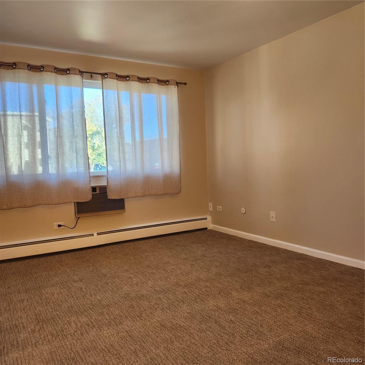 755 South Clinton Street, Unit 6B Denver, CO 80247 - Photo 26 of 48 an empty room with a window