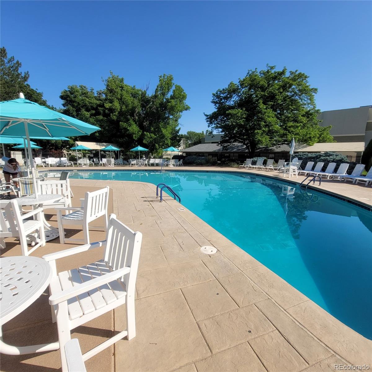 755 South Clinton Street, Unit 6B Denver, CO 80247 - Photo 33 of 48 a view of a swimming pool with lounge chairs