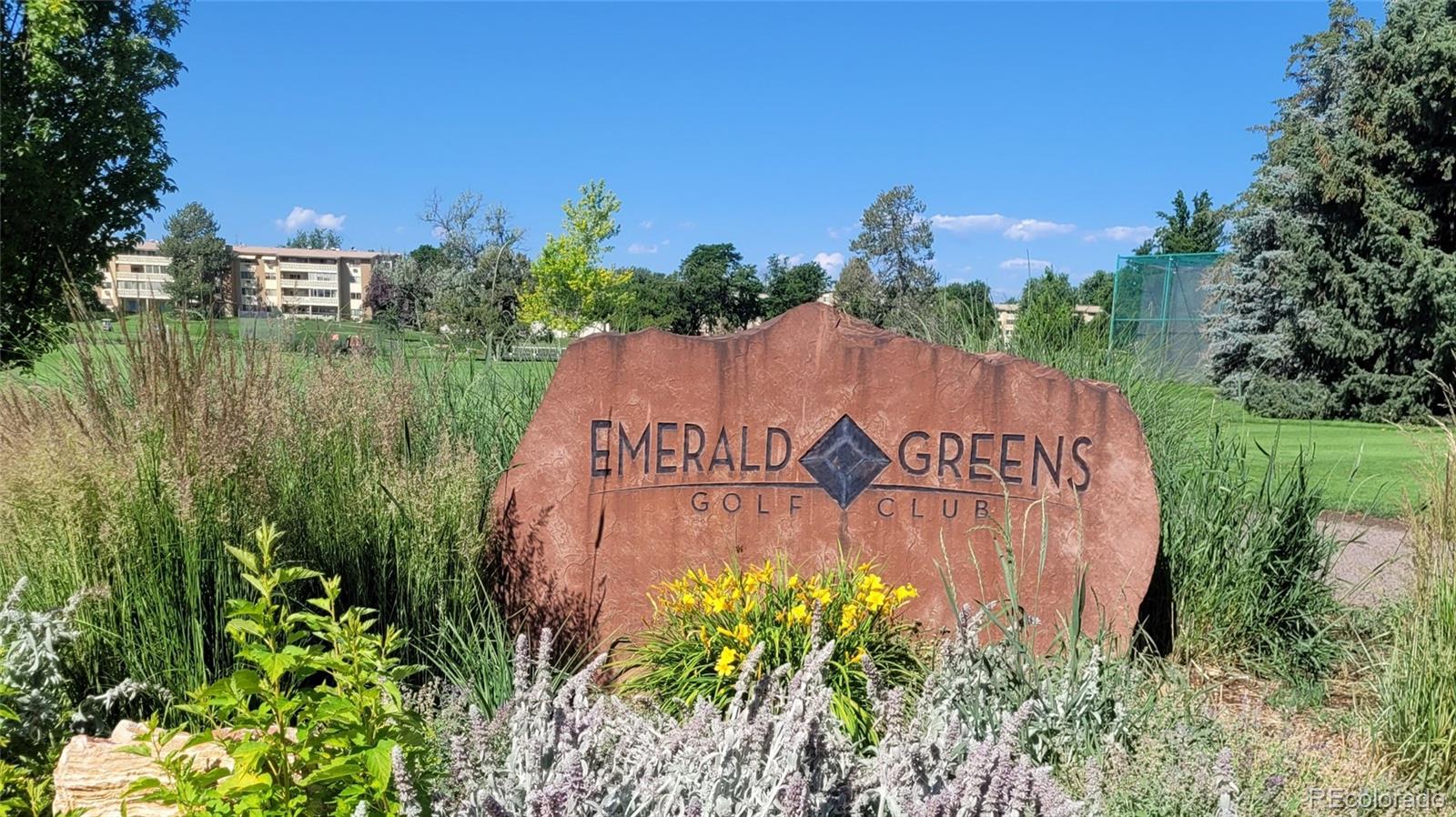 755 South Clinton Street, Unit 6B Denver, CO 80247 - Photo 35 of 48 a view of a water pond with green field