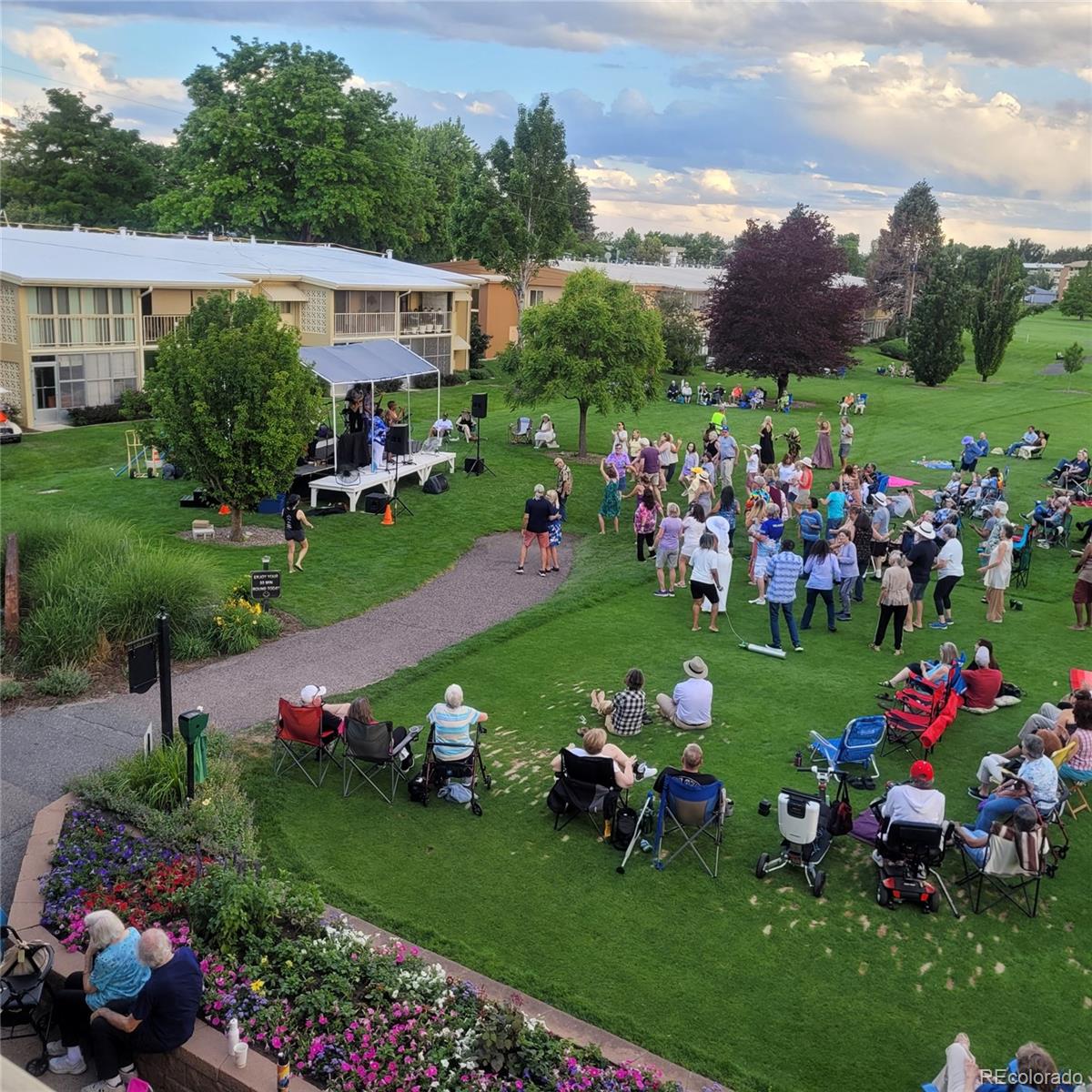 755 South Clinton Street, Unit 6B Denver, CO 80247 - Photo 39 of 48 a group of people sitting in the ground