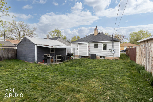 875 Patterson Street Ogden, UT 84403 - Photo 31 of 38 Rear view of house featuring a fenced backyard, a patio, and a chimney