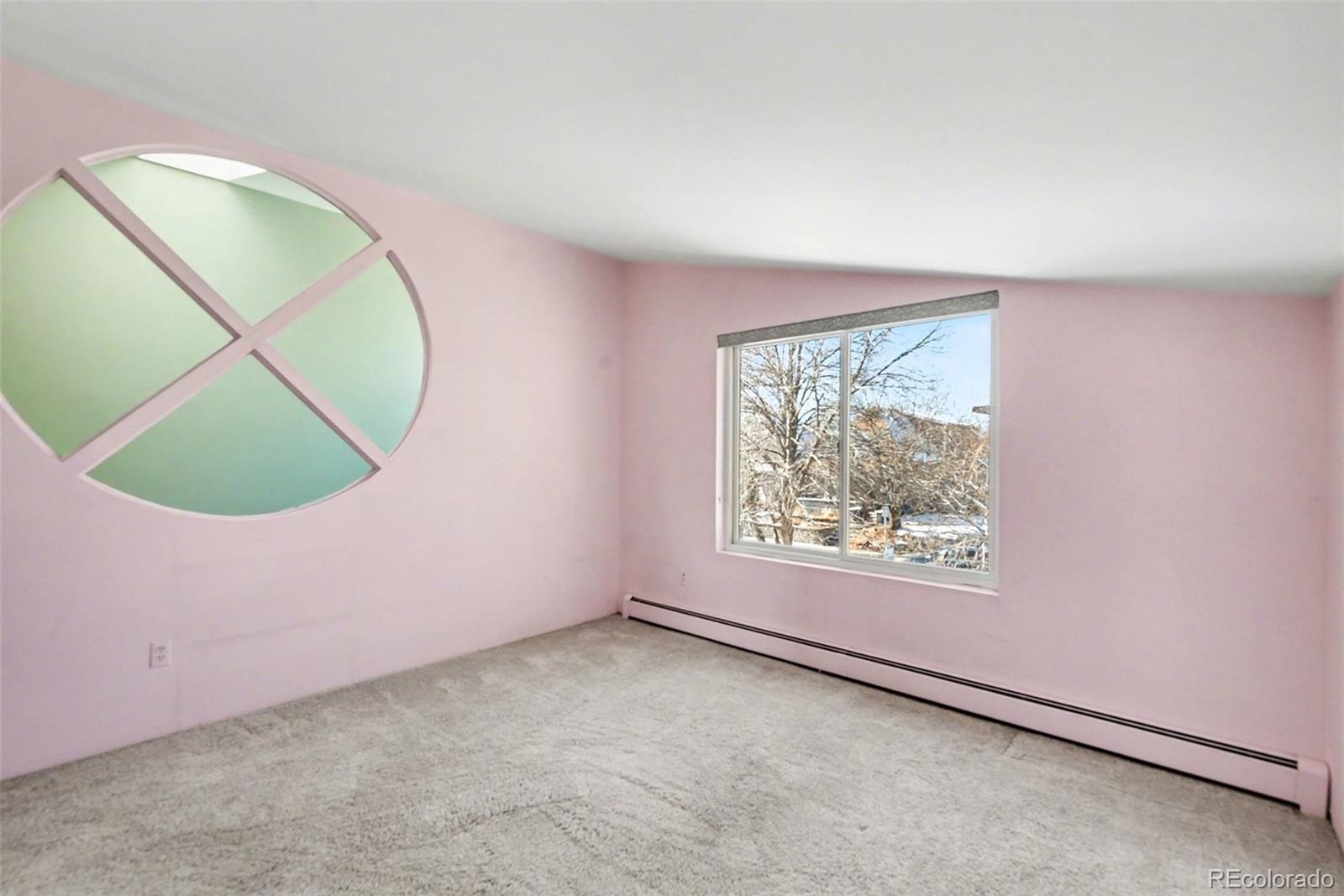 2222 Meade Street Denver, CO 80211 - Photo 14 of 19 an empty room with a window and mirror