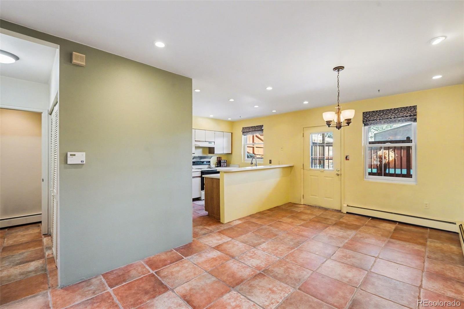 2222 Meade Street Denver, CO 80211 - Photo 7 of 19 a view of a kitchen with a sink and cabinets
