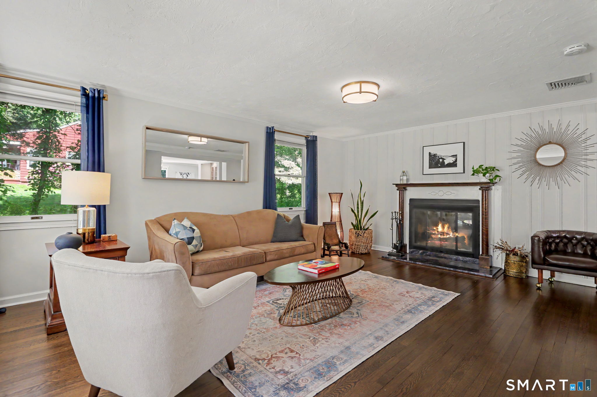 2 Rising Road Norwalk, CT 06850 - Photo 3 of 33 a living room with furniture and a fireplace