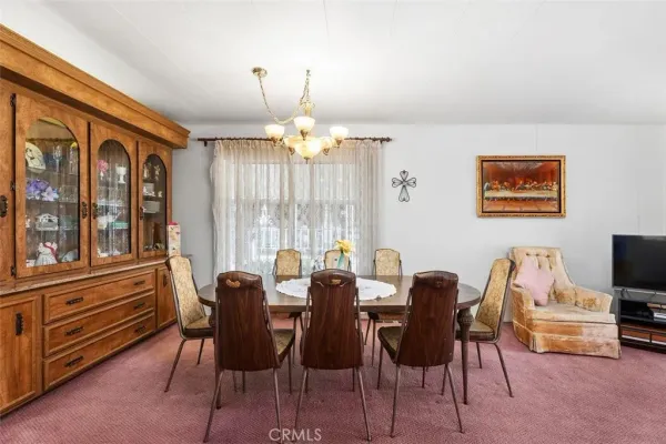 a dining room with furniture and window