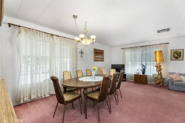 a kitchen with cabinets and window
