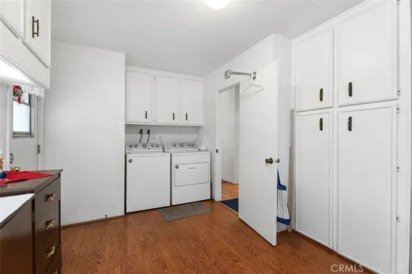 a kitchen with stainless steel appliances granite countertop a sink a stove and cabinets