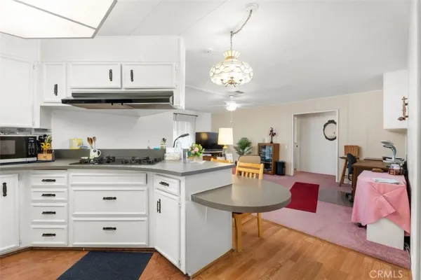 a kitchen with stainless steel appliances granite countertop a sink and cabinets