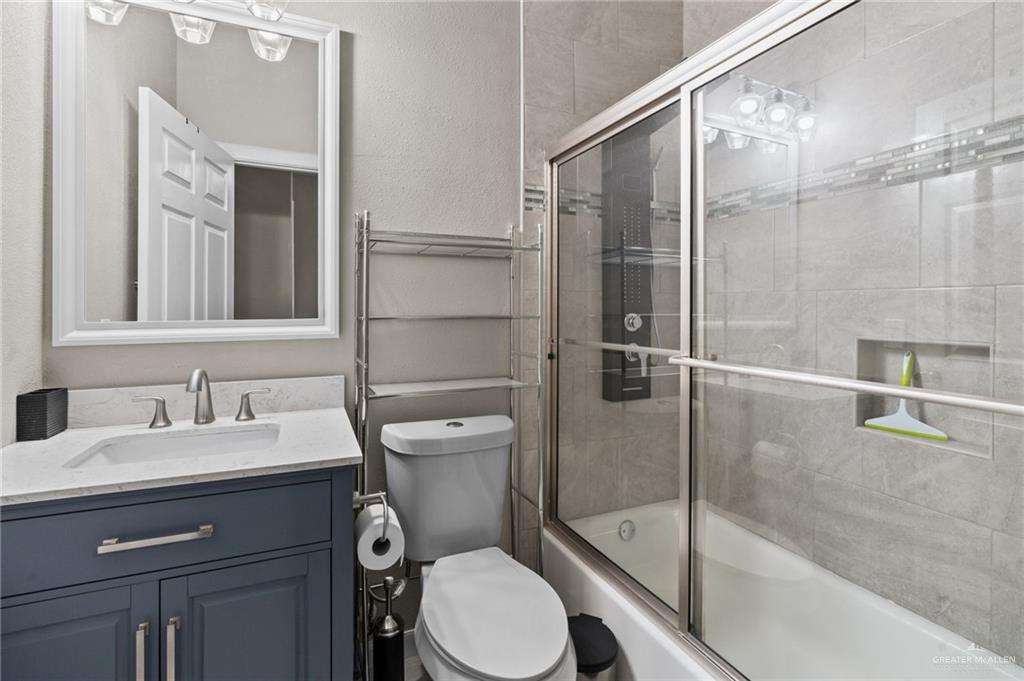 1127 Fairway Lane Harlingen, TX 78552 - Photo 14 of 23 a bathroom with a sink toilet and shower