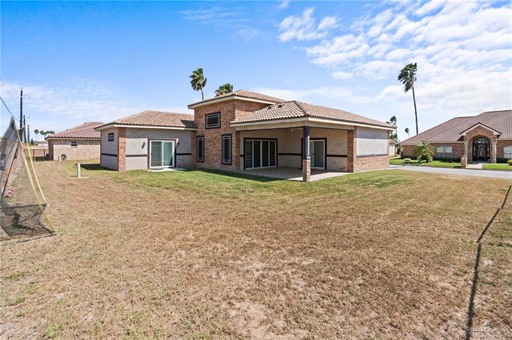 1127 Fairway Lane Harlingen, TX 78552 - Photo 21 of 23 a view of a house with a yard