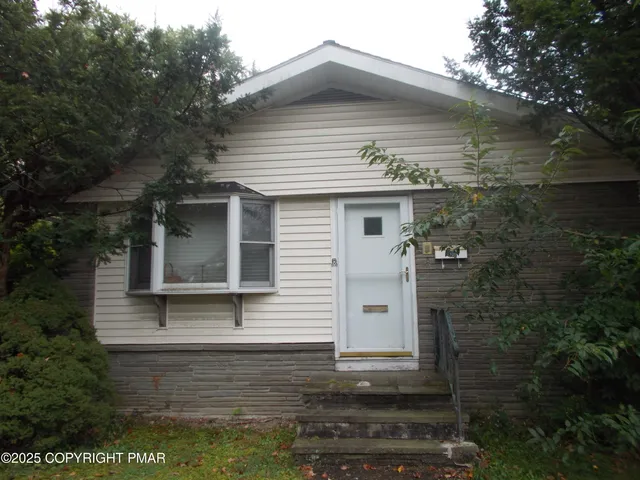 a front view of a house with garage