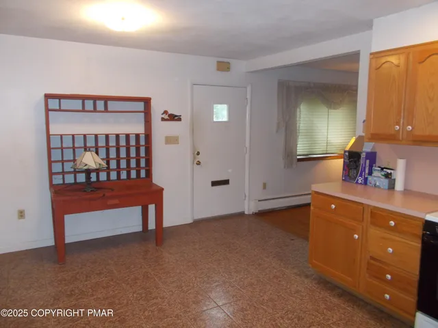 a bedroom with a bed and a dresser in it