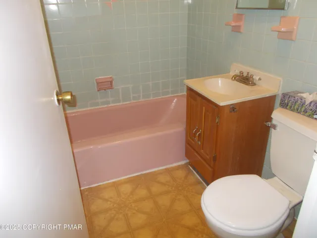 a bathroom with a sink and toilet