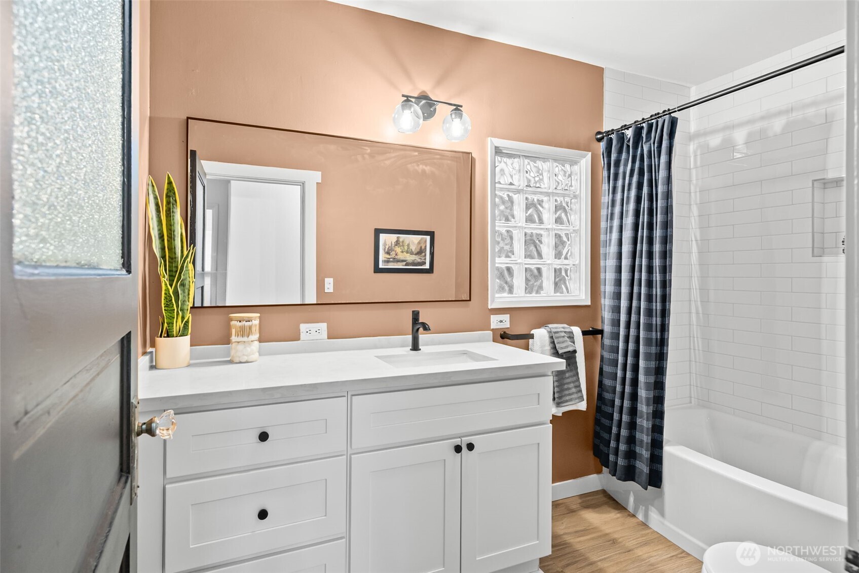 809 Sumner Avenue Sumner, WA 98390 - Photo 21 of 38 a bathroom with a sink and a mirror