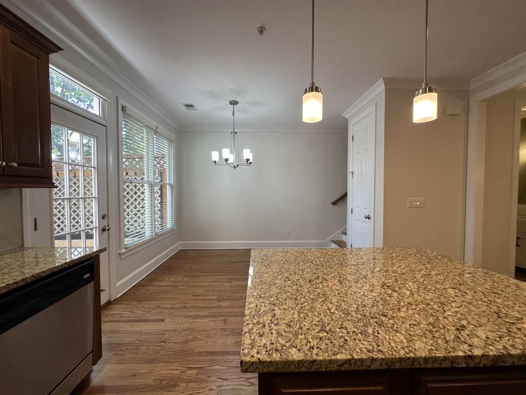 11191 Calypso Drive Alpharetta, GA 30009 - Photo 13 of 37 a view of a kitchen with a sink and wooden floor