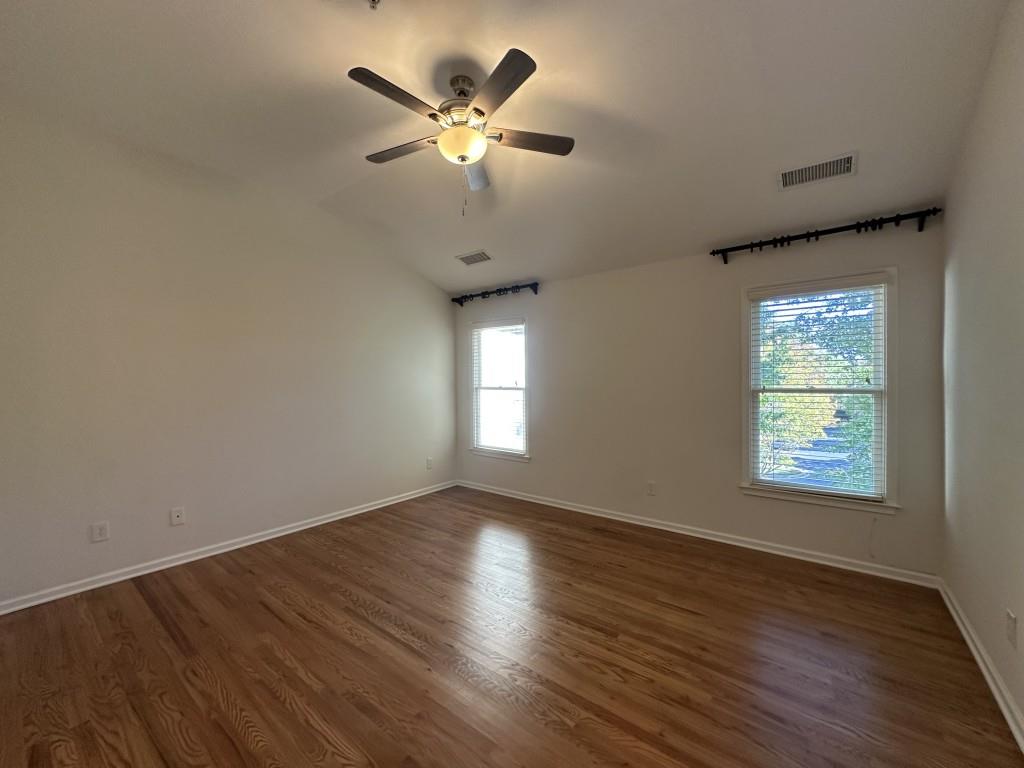 11191 Calypso Drive Alpharetta, GA 30009 - Photo 21 of 37 a view of an empty room with wooden floor and a window