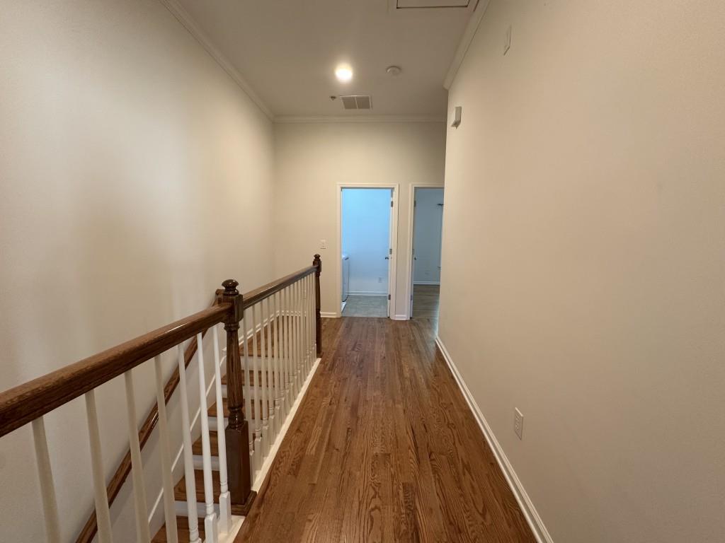 11191 Calypso Drive Alpharetta, GA 30009 - Photo 29 of 37 a view of a hallway with wooden floor and staircase