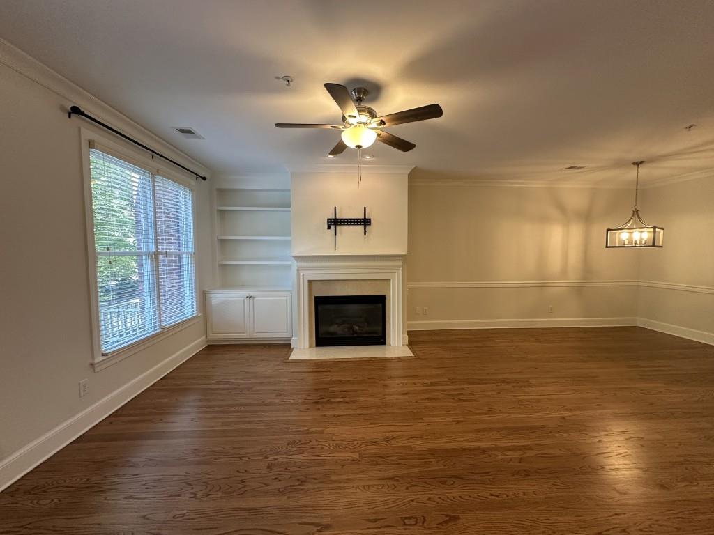 11191 Calypso Drive Alpharetta, GA 30009 - Photo 6 of 37 a view of a livingroom with a fireplace and window