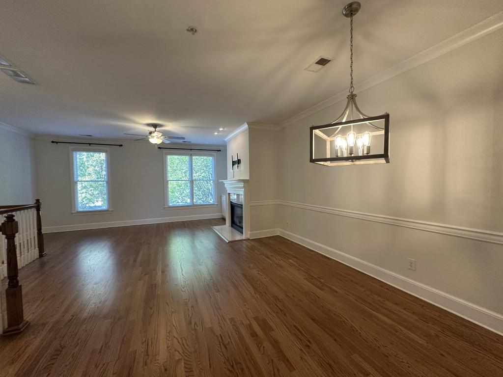 11191 Calypso Drive Alpharetta, GA 30009 - Photo 9 of 37 a view of empty room with window and wooden floor