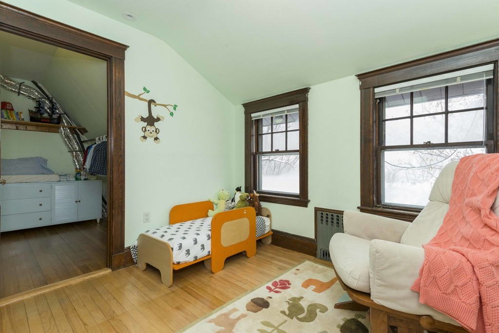 3 Addington Road, Unit 2 Brookline, MA 02445 - Photo 15 of 27 a bedroom with a bed and wooden floor