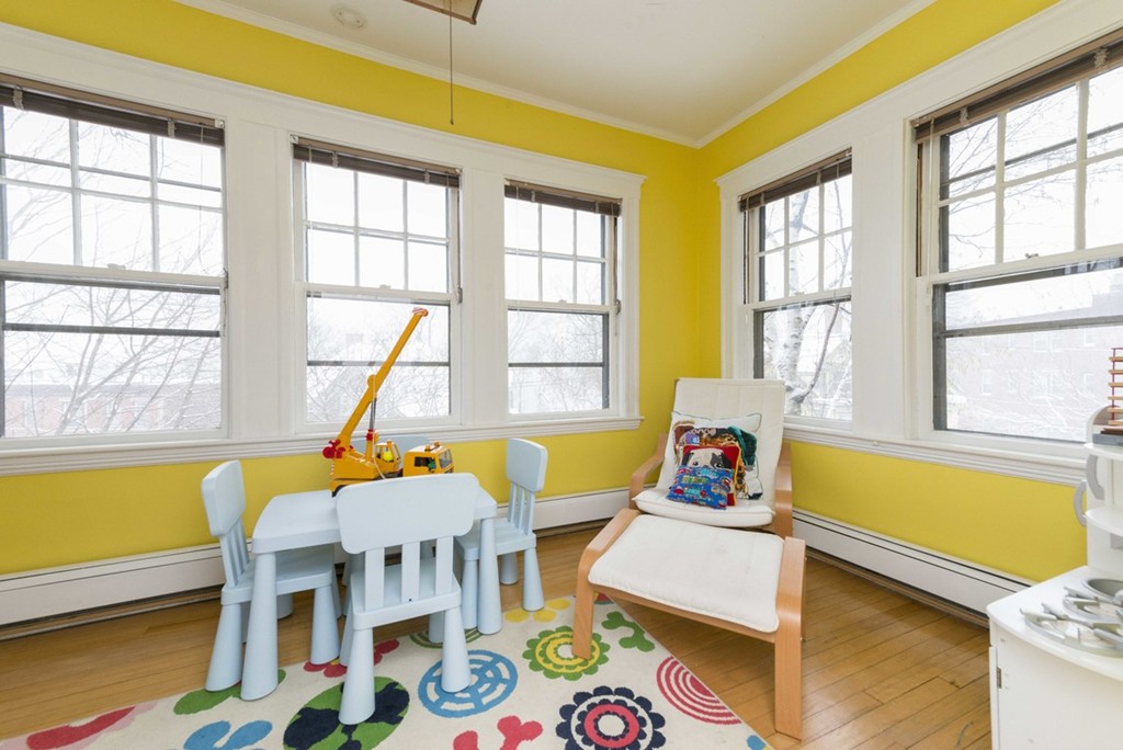 3 Addington Road, Unit 2 Brookline, MA 02445 - Photo 8 of 27 a bedroom with furniture and a large window