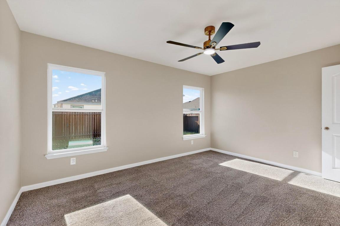 606 Aplite Pass Maxwell, TX 78656 - Photo 16 of 30 Spare room featuring carpet and ceiling fan
