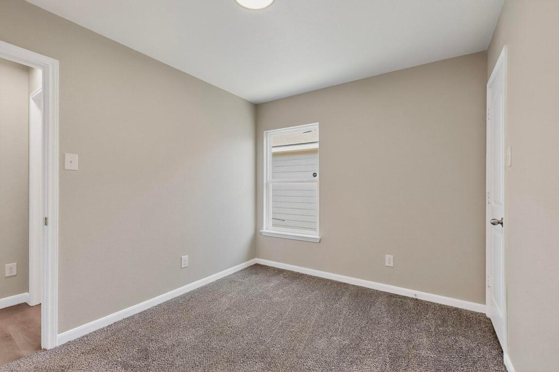 606 Aplite Pass Maxwell, TX 78656 - Photo 21 of 30 Carpeted spare room featuring baseboards