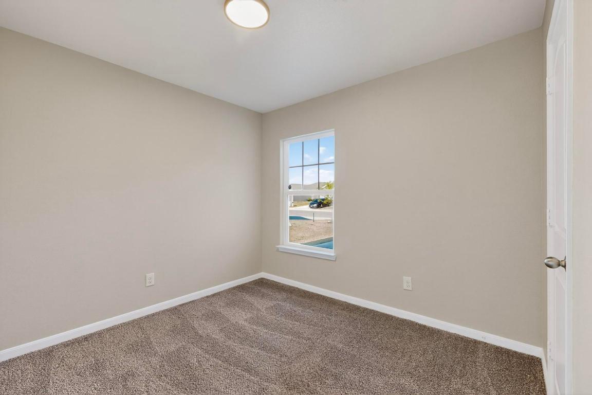 606 Aplite Pass Maxwell, TX 78656 - Photo 24 of 30 Carpeted spare room featuring baseboards