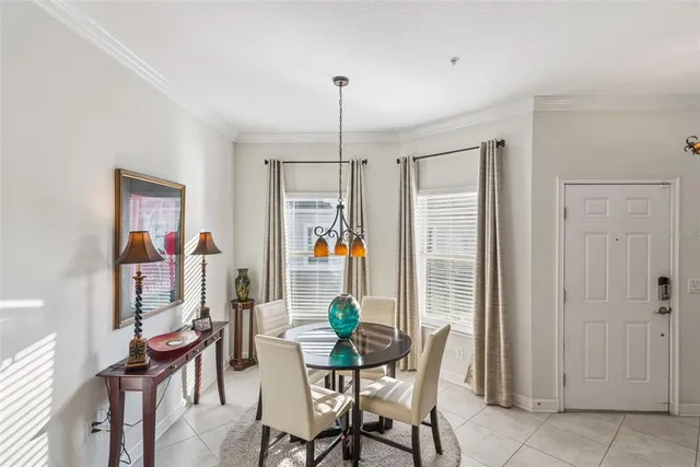 a dining room with furniture and window