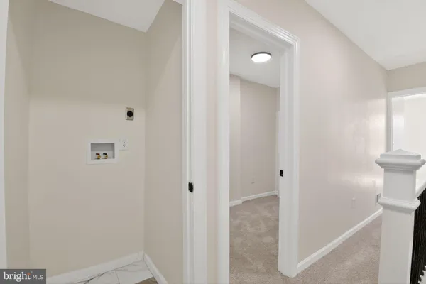 a view of a hallway with toilet