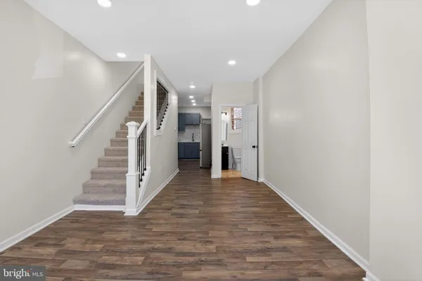 a view of entryway with wooden floor