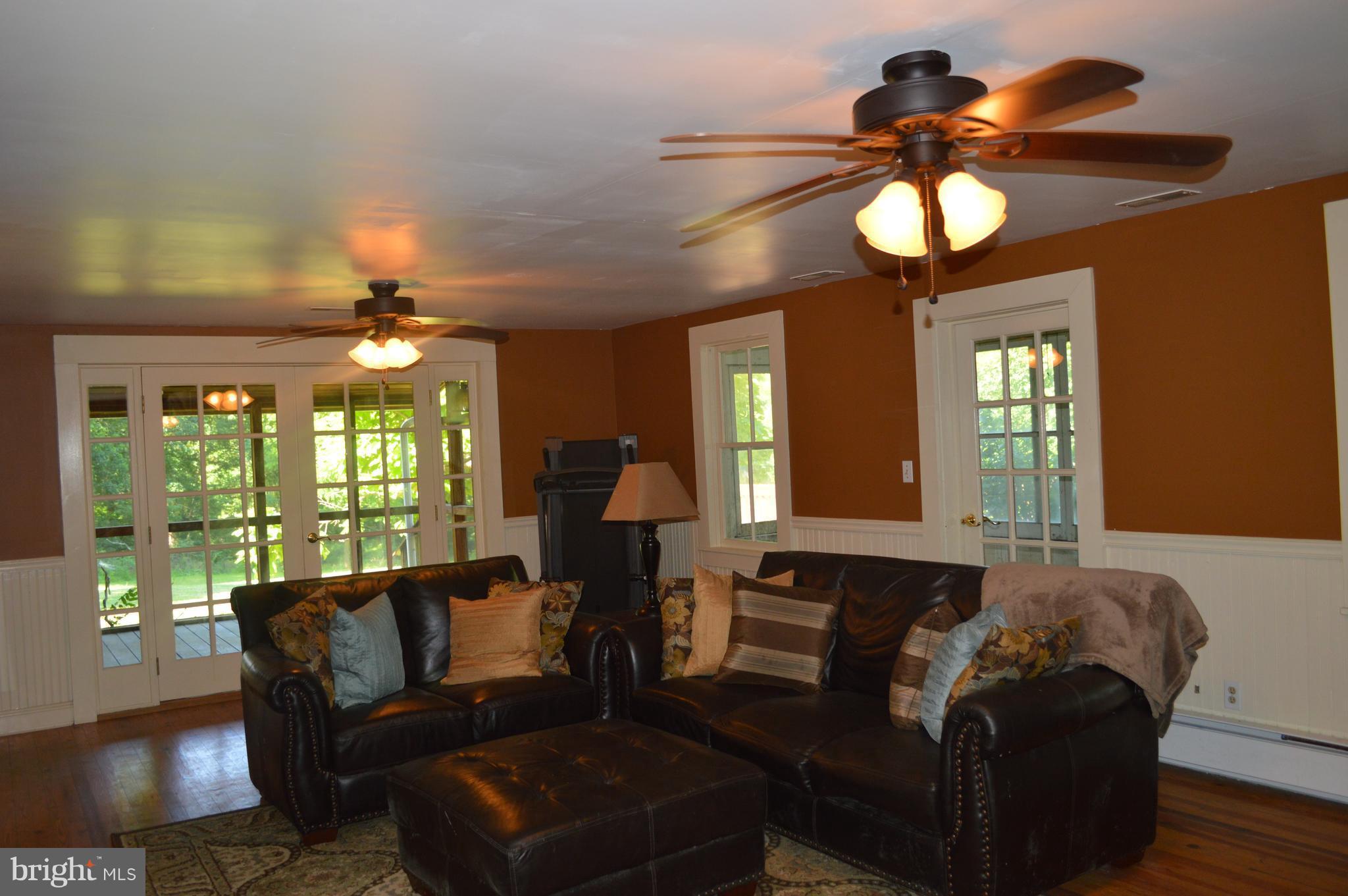 2034 Smith Run Road Bentonville, VA 22610 - Photo 17 of 30 Family Room looking out to the screened porch