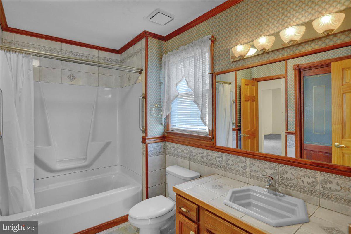 4496 Pheasant Run Reading, PA 19606 - Photo 21 of 37 a bathroom with a sink and a mirror