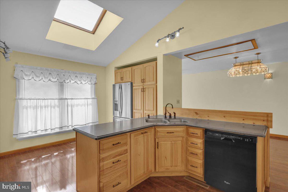 4496 Pheasant Run Reading, PA 19606 - Photo 6 of 37 a kitchen with granite countertop a sink and a window
