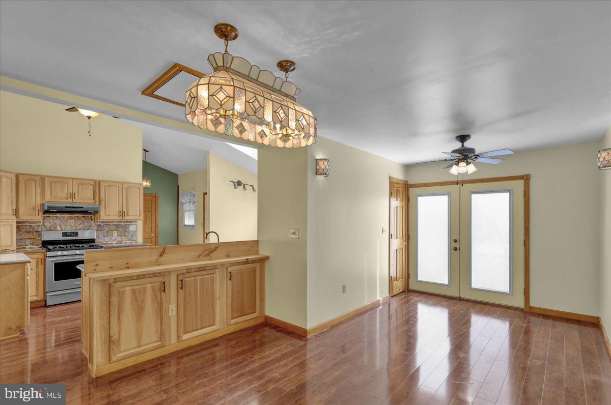 4496 Pheasant Run Reading, PA 19606 - Photo 10 of 37 a view of a kitchen with a sink wooden floor and a window