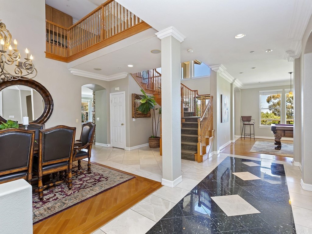 602 West Bluff Court Encinitas, CA 92024 - Photo 17 of 69 a living room with furniture a rug and a chandelier