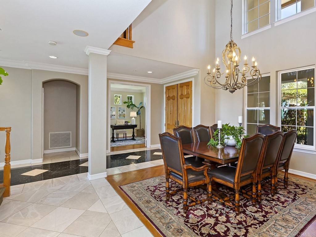 602 West Bluff Court Encinitas, CA 92024 - Photo 18 of 69 a view of a dining room with furniture and a chandelier