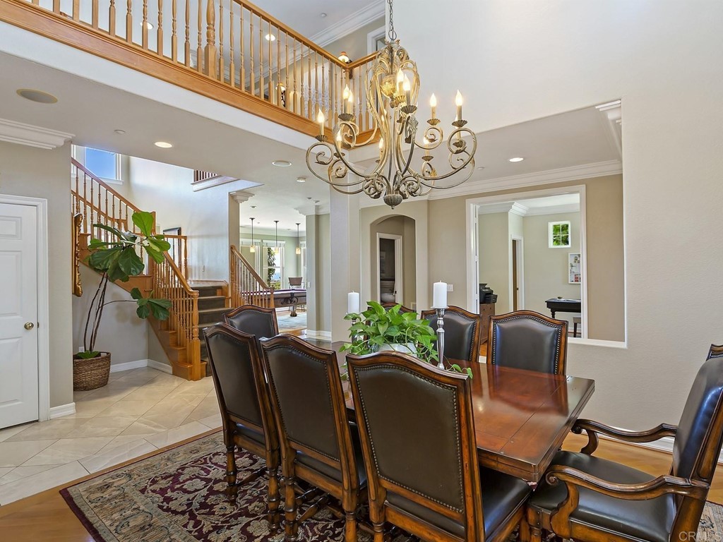 602 West Bluff Court Encinitas, CA 92024 - Photo 19 of 69 a view of a dining room with furniture and a chandelier