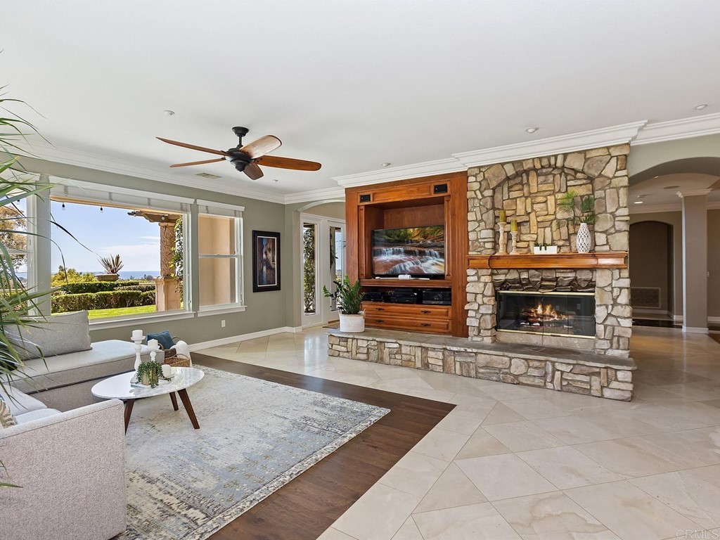 602 West Bluff Court Encinitas, CA 92024 - Photo 20 of 69 a living room with furniture a rug and a fireplace